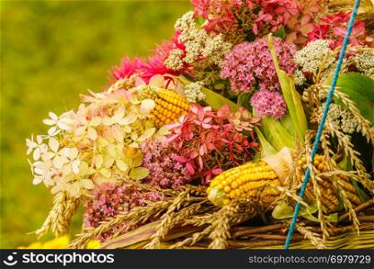 Decorative bouquet made of field flowers and hay. Folk decorations conept.. Bouquet made of field flowers and hay