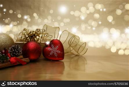 Decorative Christmas background with baubles, gifts and ribbon with bokeh lights
