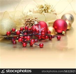 Decorative Christmas background with berries, baubles and gift