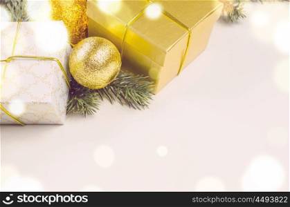 decorative christmas gift boxes and balls on white surface, view from above