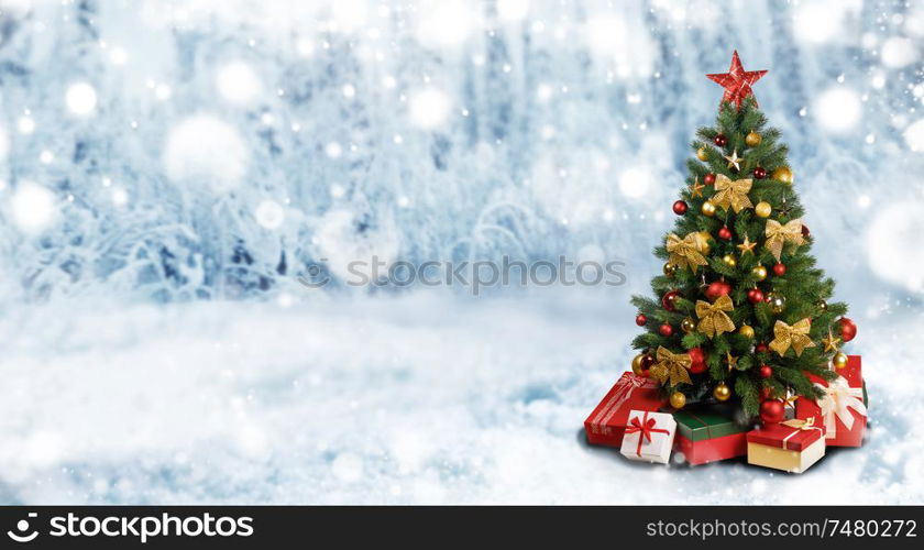 Decorative Christmas Tree over winter snowy forest background wit copy space. Christmas Tree in winter