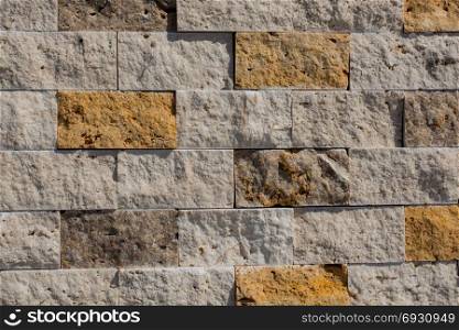Decorative cubic stone wall as background texture