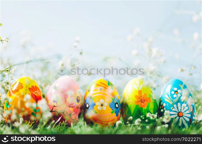 Decorative eggs on green grass. Easter, traditioonal Christian spring holiday. Copyspace.. Decorative eggs on green grass.