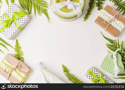 decorative gift boxes leaves twig arranged white background