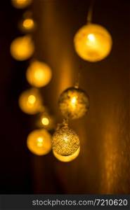 Decorative globe, light bulbs on the wall. Hanging lights. Selective focus
