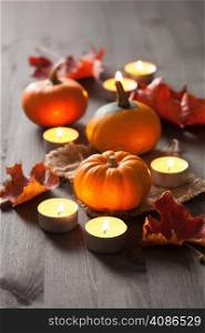 decorative halloween pumpkins and candles