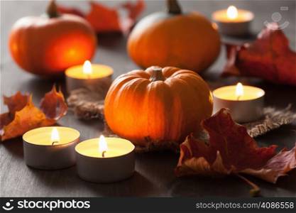decorative halloween pumpkins and candles