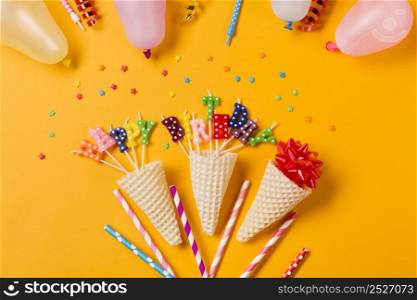 decorative happy birthday cone decoration yellow backdrop