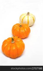 Decorative orange and white pumpkins isolated on a white background. Three Decorative Pumpkins