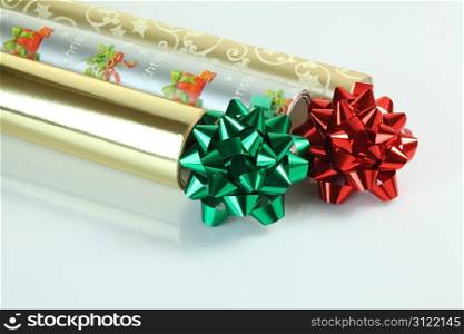 Decorative pompoms and wrapping paper with reflection