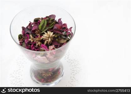 Decorative pot filled with dried flowers on white background