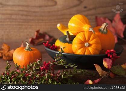 decorative pumpkins and autumn leaves for halloween