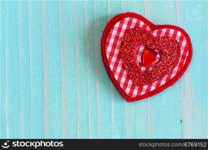 Decorative red heart on nice wooden background with copy-space