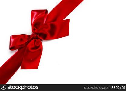 Decorative red satin bow isolated on white background
