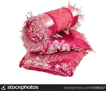 decorative red silk pillows on white background