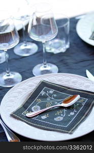 Decorative table serving. Glasses and plates.