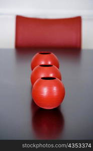 Decorative urns on a dining table in a dining room