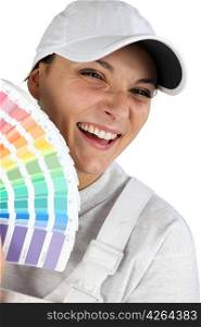 Decorator holding paint color charts