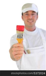 Decorator holding paintbrush