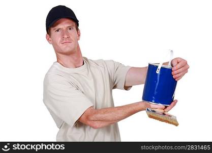 Decorator holding tin of blue paint