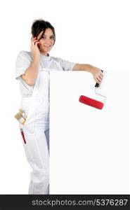 Decorator with a blank board and paint roller