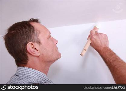 Decorator with a paintbrush