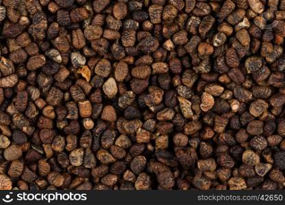 Decorticated cardamom seeds close up image can be used for background