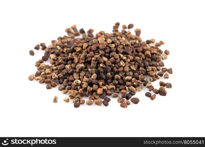 Decorticated cardamom seeds pile on a white background