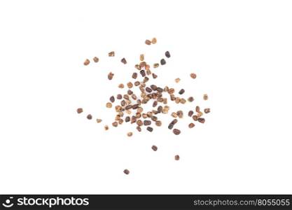 Decorticated cardamom seeds pile on a white background