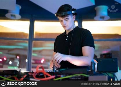 Deejay mixing at party. High quality photography.. Deejay mixing at party