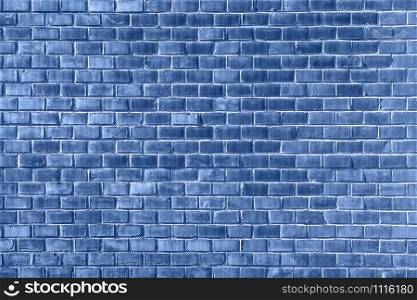 Deep blue Brick wall texture close up. Top view. Modern brick wall wallpaper design for web or graphic art projects. Trendy banner toned in classic blue - color of the 2020 year. Deep blue Brick wall texture close up. Top view. Modern brick wall wallpaper design for web or graphic art projects.