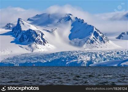Deep Blue Glacier and Snowcapped Mountains, Albert I Land, Arctic, Spitsbergen, Svalbard, Norway, Europe
