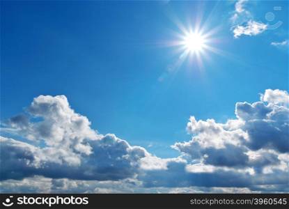 Deep blue sky with clouds and sun. Nature composition.