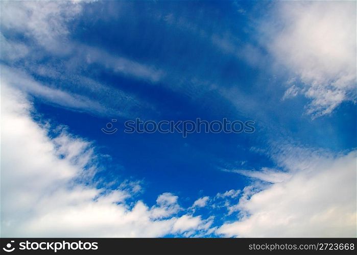 deep blue sky with clouds background