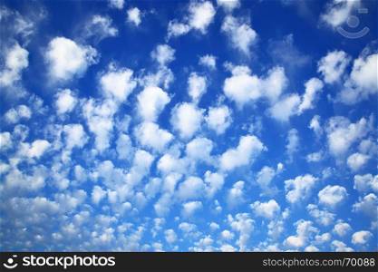 Deep blue sky with clouds, may be used as background