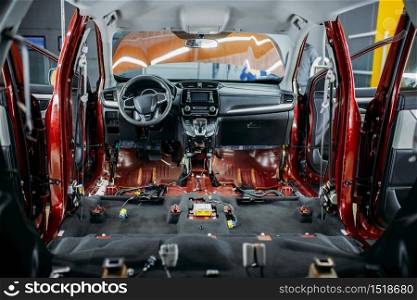 Deep car tuning, disassembled vehicle interior closeup, nobody. Auto detailing. Automobile in garage, no brand. Deep car tuning, disassembled vehicle interior