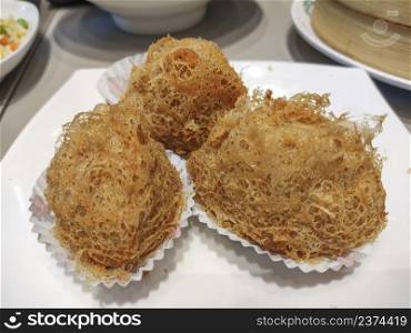 Deep-fried beehive like yam puff with minced meat. Chinese dim sum