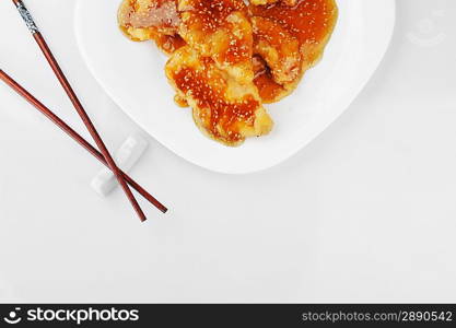 deep fried chicken with red sauce. chinese cuisine