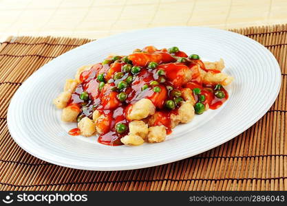 deep fried chicken with red sauce. chinese cuisine