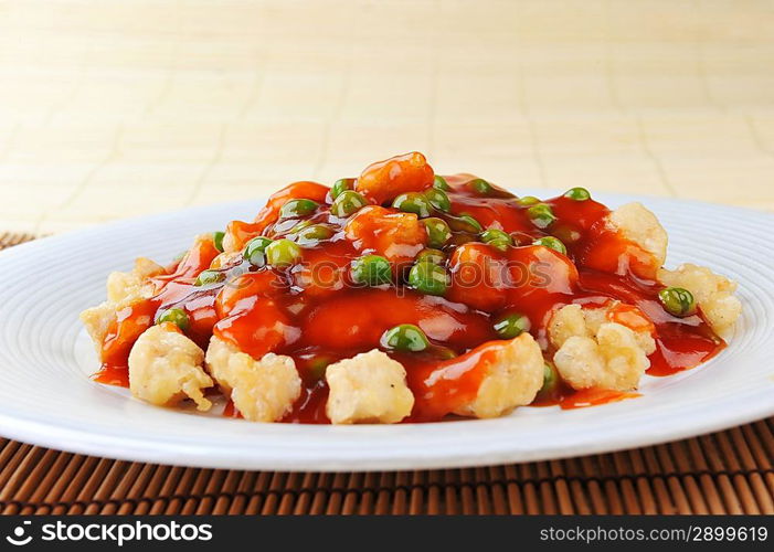 deep fried chicken with red sauce. chinese cuisine