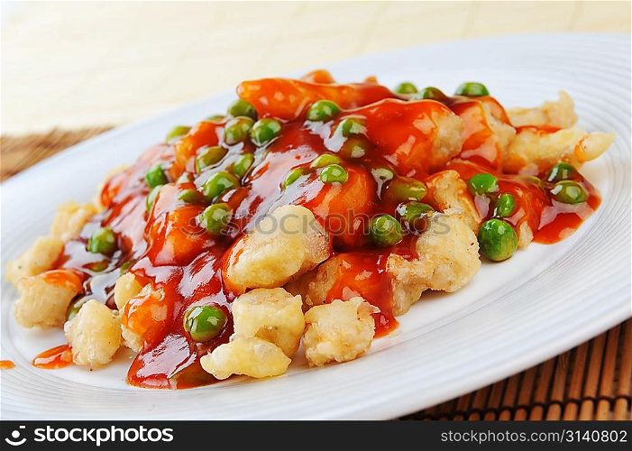 deep fried chicken with red sauce. chinese cuisine