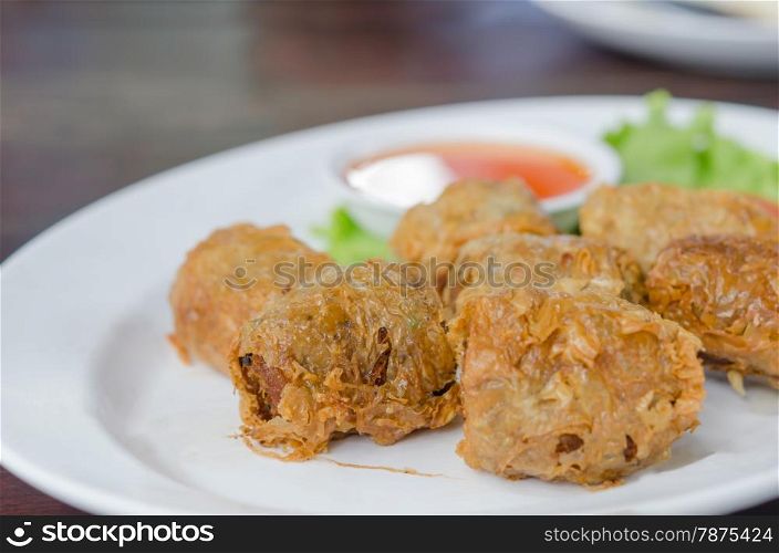 deep fried crab meat roll cake on white dish , chinese food