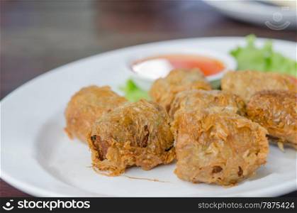 deep fried crab meat roll cake on white dish , chinese food