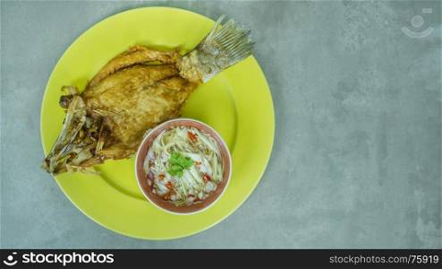 Deep fried fish with green mango salad