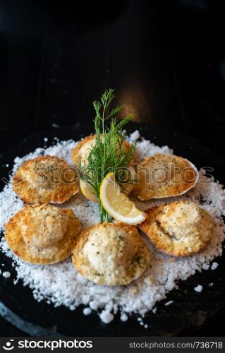 deep fried Hokkaido Scallops Shell with crusty bread serve with lemon and salt.
