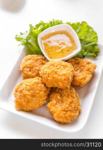 deep-fried shrimp cakes with sweet sauce on white background