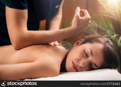 Deep Tissue Massage Therapy. Therapist massaging Woman&rsquo;s Back, using Elbow Pressure.. Deep Tissue Massage Close up.