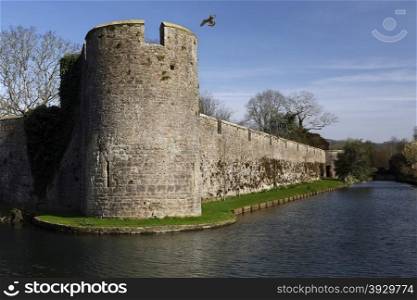 Defensive walls of the Bishops Palace in the City of Wells in Somerset, England