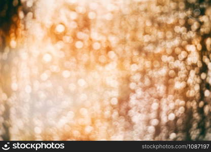 Defocused Abstract golden lights background for Christmas