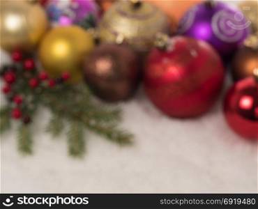 Defocused background of Christmas balls in the snow